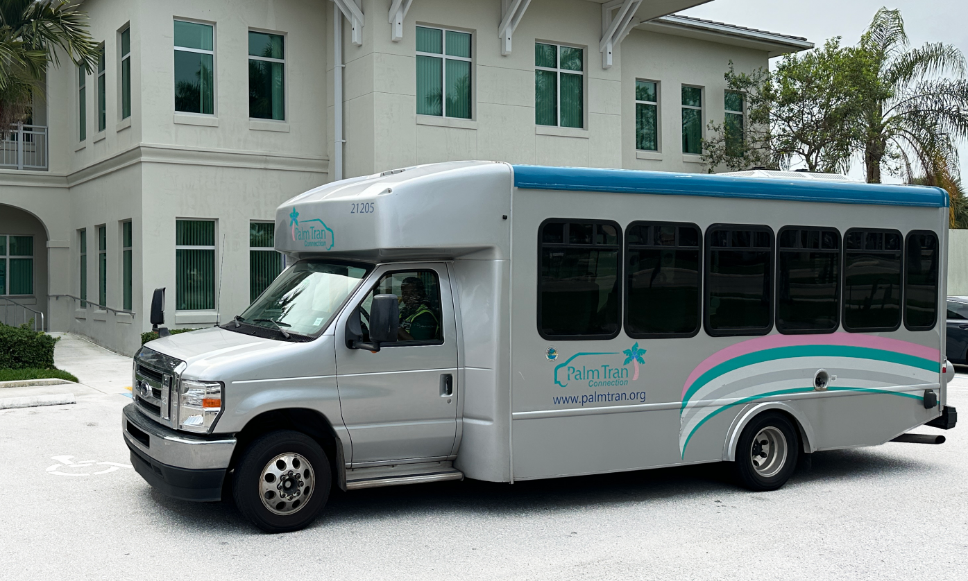 Palm Tran Connection Van in front of building
