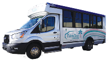 White and blue shuttle bus with large windows and "Kimliiz Shuttle" logo on the side, parked on a neutral background.
